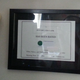 The Rating certificate as it appears on my wall. On the left is my corner for old consoles.
